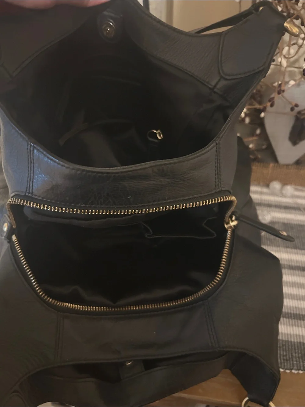 Coach Black Leather Shoulder Bag with Front Buckle Pocket and Gold Hardware